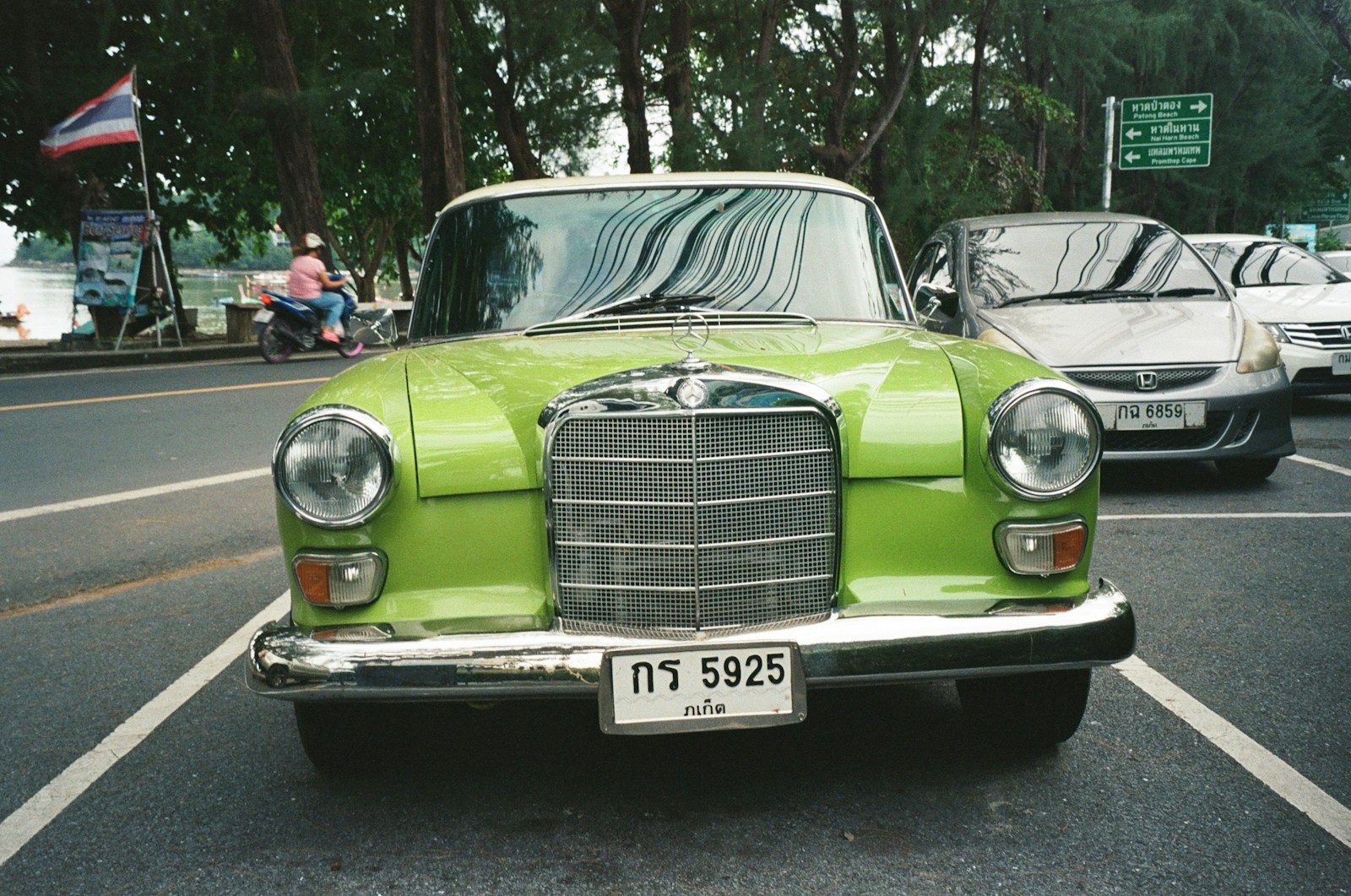 a green car on the street