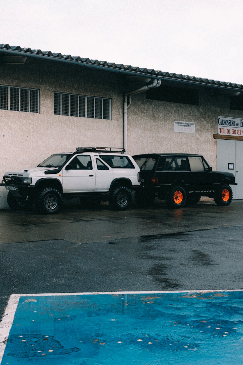 a couple of cars parked in front of a building